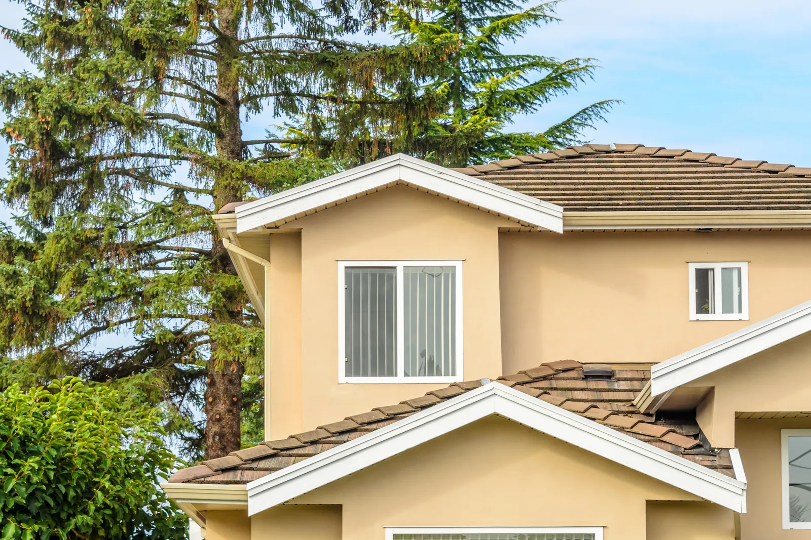 Tan two-storey suburban home exterior