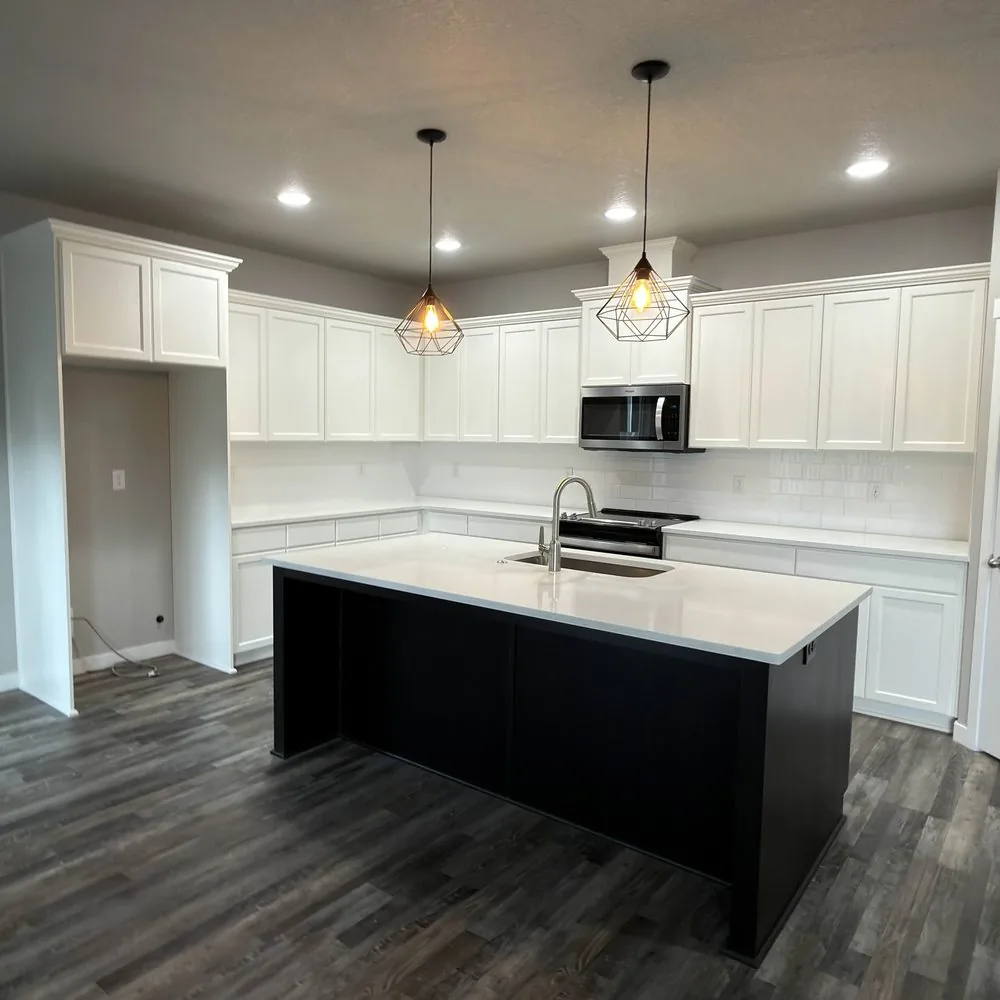 The same kitchen cabinets sprayed white after refinishing by Tall Pine Painting in Vancouver, WA