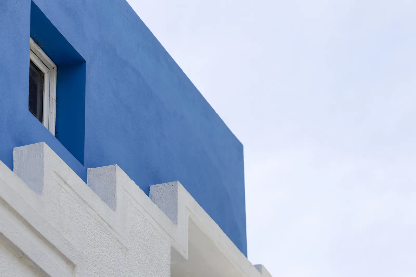 Blue and white painted commercial building corner