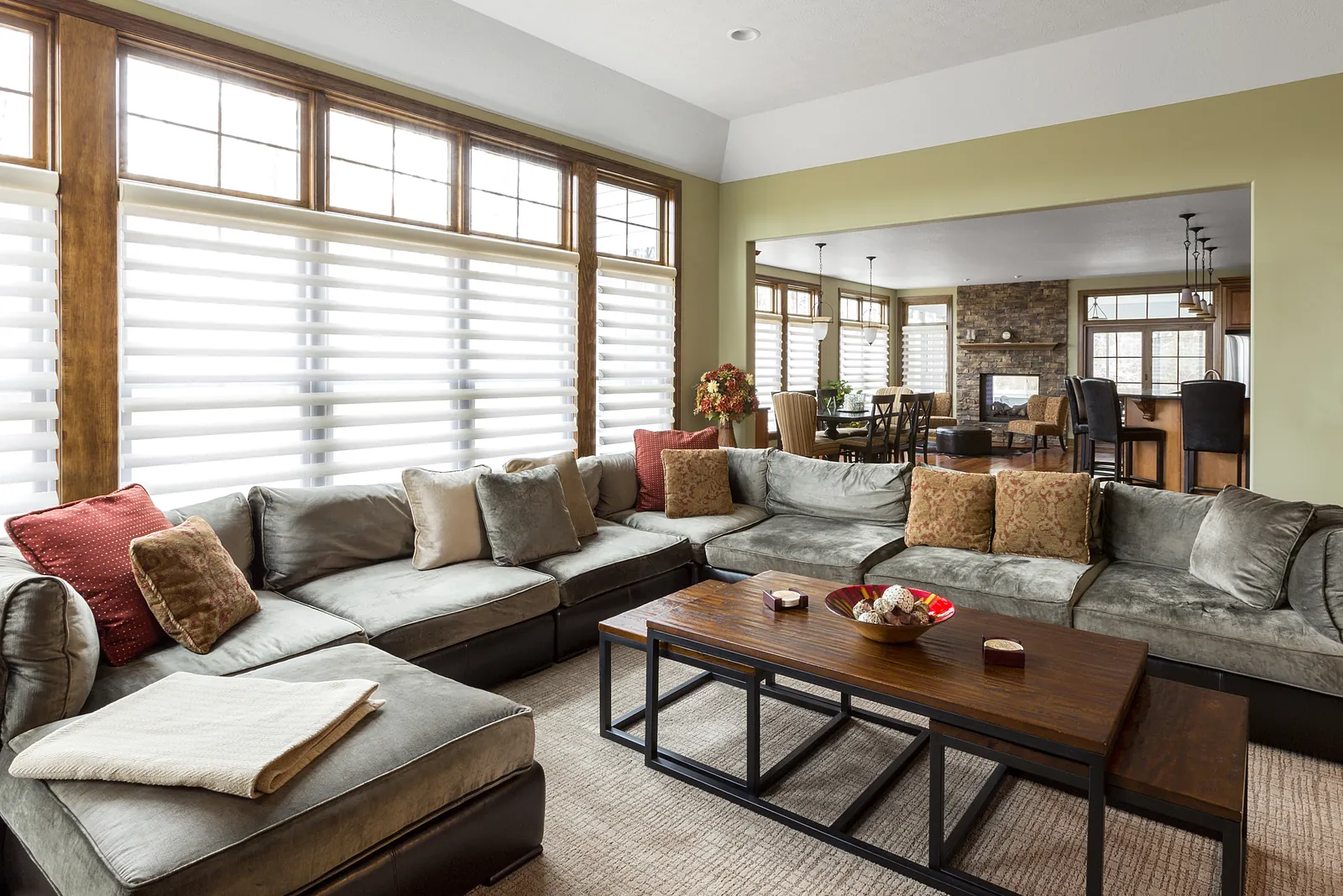 Living room with a large sectional sofa and freshly painted walls